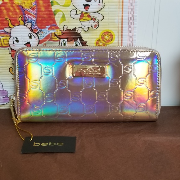 bebe Handbags - bebe nwt rose gold holographic wallet/clutch